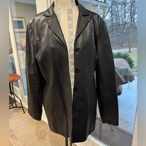 Identify 100% real leather black coat size 14
